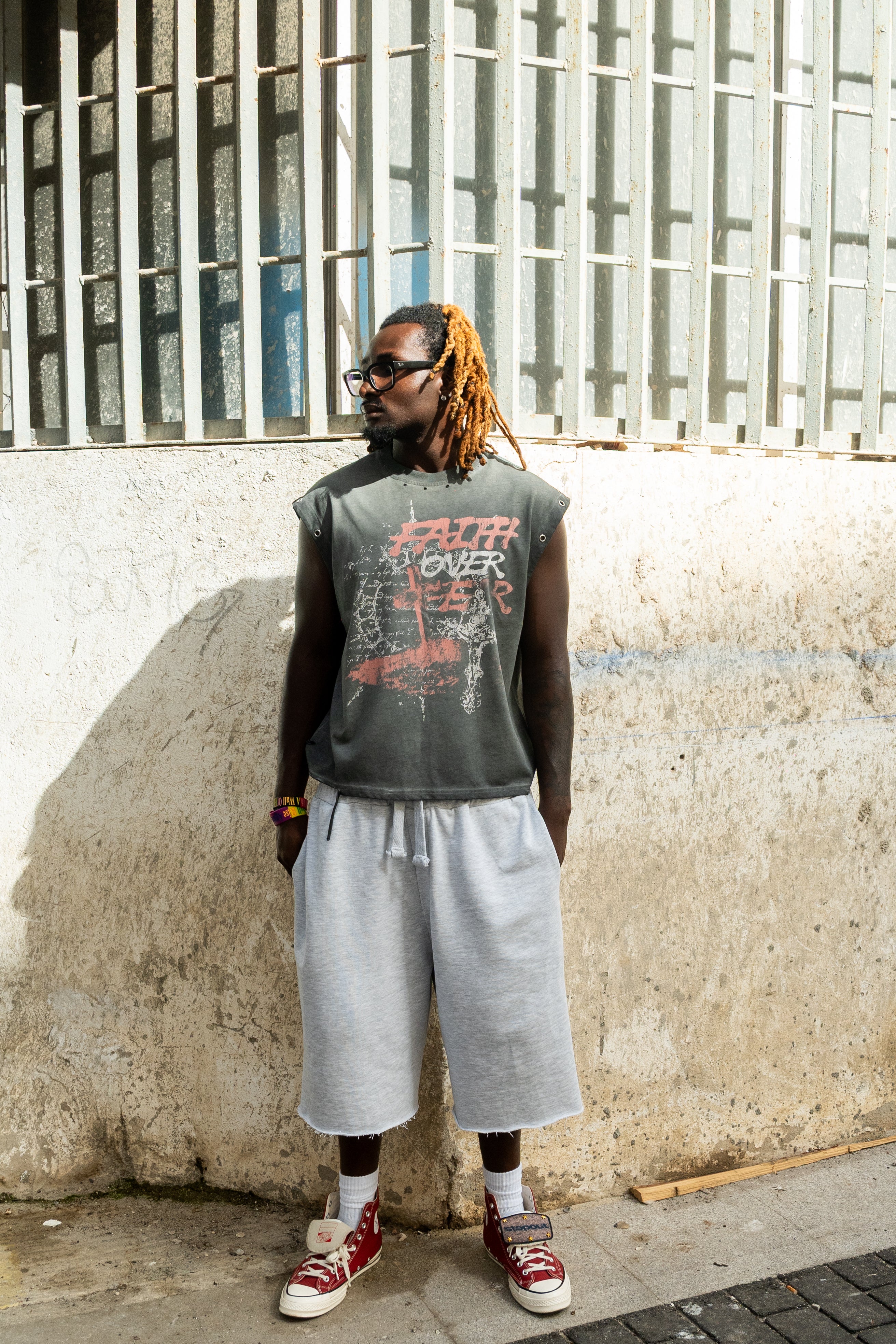 Grey “Faith over fear” distressed grommet tank top